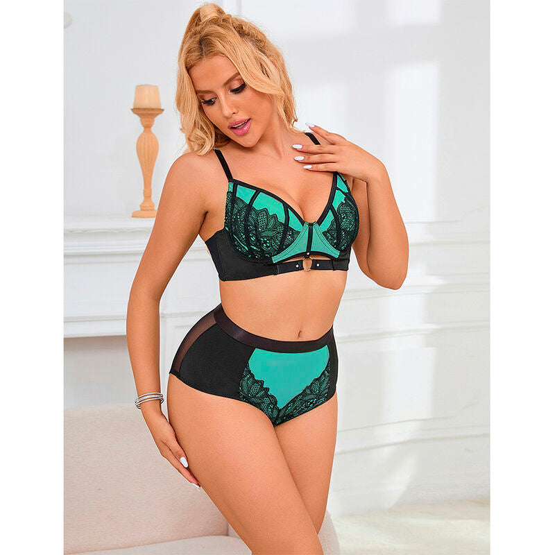 Modele de face en parure noire et turquoise Subblime, soutien-gorge dentelle florale et culotte taille haute, parure structuree glamour decor lumineux.