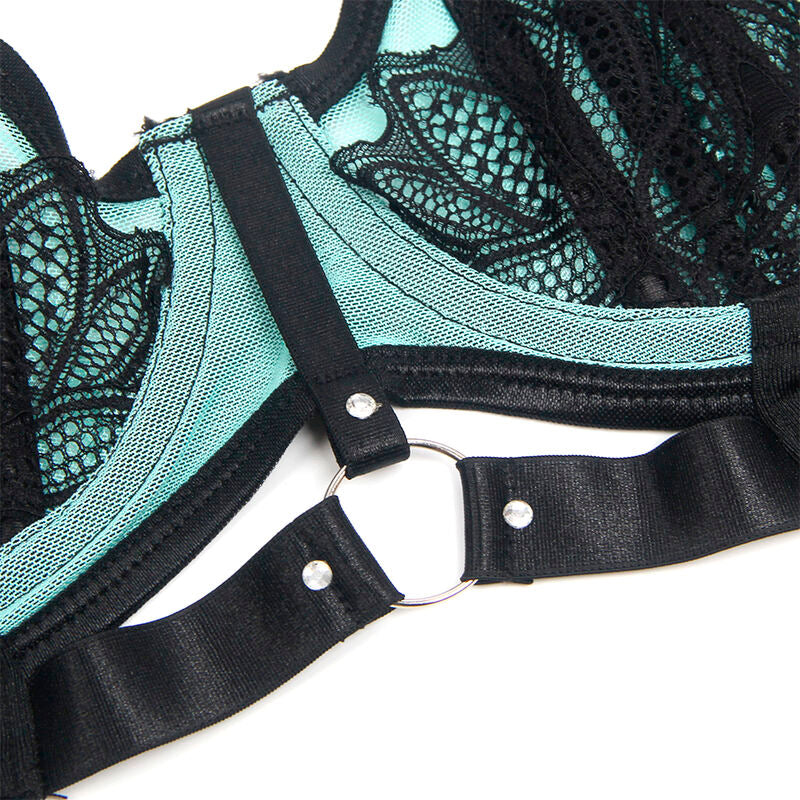 Detail des bretelles satinees, de l'anneau metallique et de la dentelle turquoise du soutien-gorge Subblime, gros plan sur la finition de la parure structuree.