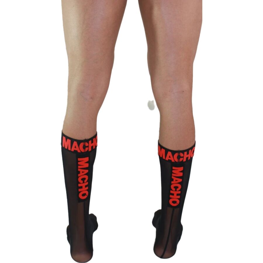Chaussettes hautes homme noires semi-transparentes vues de dos, bande Macho rouge, maille polyester elastique fetichiste epousant le mollet.