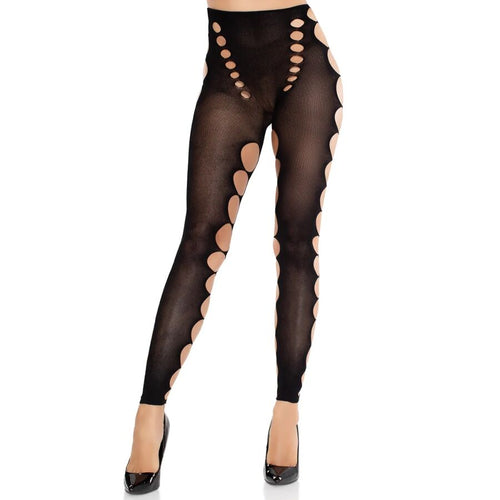 Bas opaques noirs a decoupes circulaires laterales portes sur jambes, ouvertures graphiques le long de la cuisse, finition jusqu'aux escarpins.