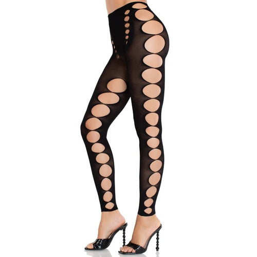 Collant noir Leg Avenue a trous ovales ajoures, porte de profil sur modele, large bande de peau nue le long de la jambe et de la hanche.