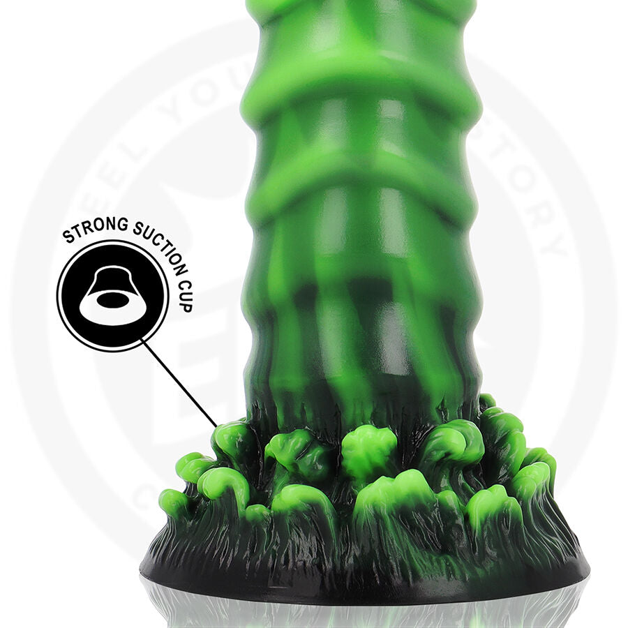 Detail de la base feuillue noire du gode fantaisie vert phosphorescent, pictogramme strong suction cup, silicone flexible pour une fixation ferme stable.
