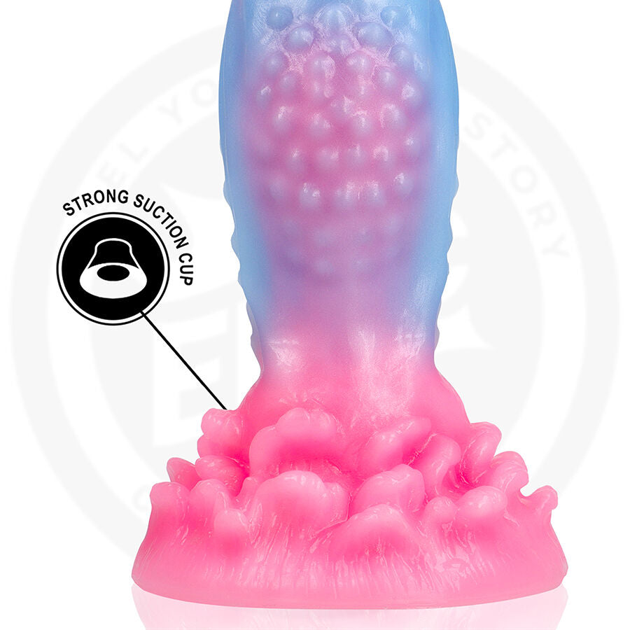 Detail de la base corail rose du gode fantaisie Oceara, relief perle et pictogramme strong suction cup, silicone flexible pour une fixation ferme stable.
