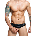 Jockstrap noir Dngeon avec cockring intégré et clous métalliques, porté de face