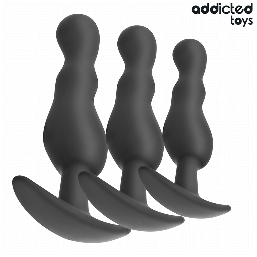Lot de trois plugs anaux ondules Addicted en silicone souple noir, tailles croissantes et bases ancres de securite, forme progressive pour une initiation douce.