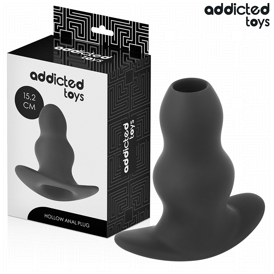 Plug anal creux Addicted en silicone noir 15,2 cm pres de sa boite, large ouverture tunnel et base evasee galbee pour une sensation d'ouverture lors des jeux avances.