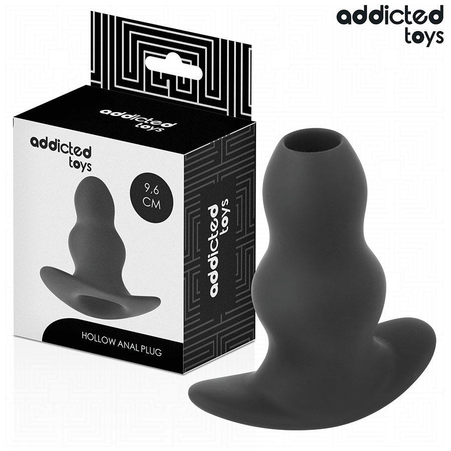 Plug anal creux Addicted en silicone noir 9,6 cm pres de sa boite, tunnel central ouvert et large base evasee pour une sensation d'ouverture lors des jeux anaux.