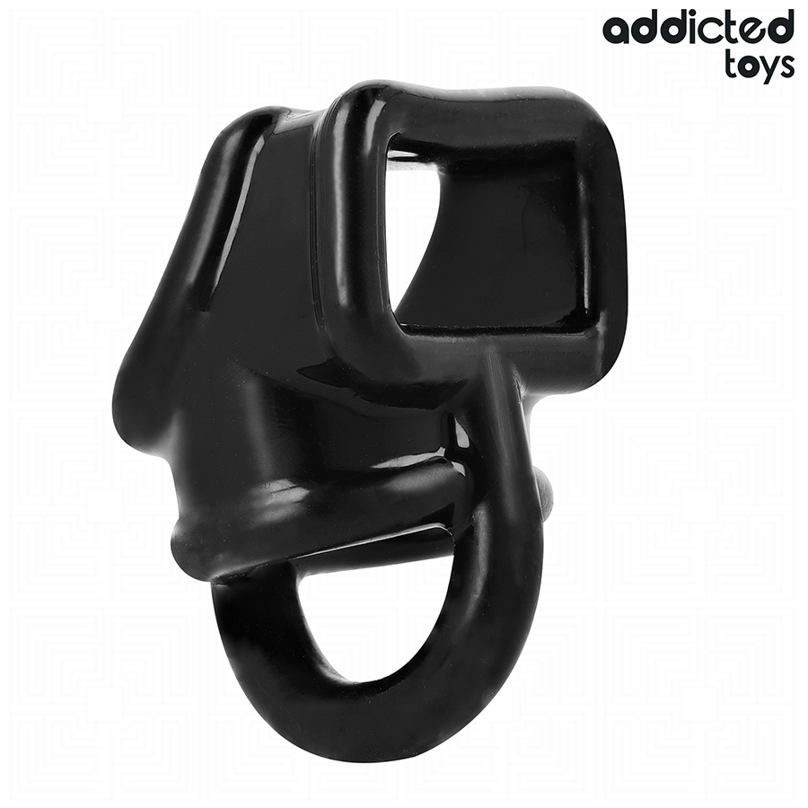 Cage cockring en silicone noir Addicted a structure ajouree enveloppant le penis et les testicules, accessoire de maintien et de contention souple vu seul.