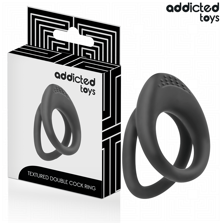 Boite Textured Double Cock Ring Addicted avec son anneau penien double texture en silicone noir, cockring a deux boucles pour le maintien de l'erection.
