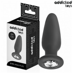 Plug anal bijou Addicted en silicone noir 8,8 cm avec cristal scintillant a la base, presente pres de sa boite, forme effilee pour une insertion douce et un maintien sur.