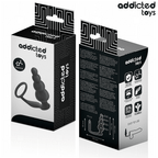 Boite Addicted du plug anal a billes avec anneau penien, packaging noir et blanc face et dos, visuel du combine silicone a billes et anneau et pictogrammes.