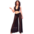 Ensemble Chilirose deux pieces de face, top noir noue et pantalon large transparent, taille basse et ventre nu, voile fluide flottant sur fond bleu nuit.