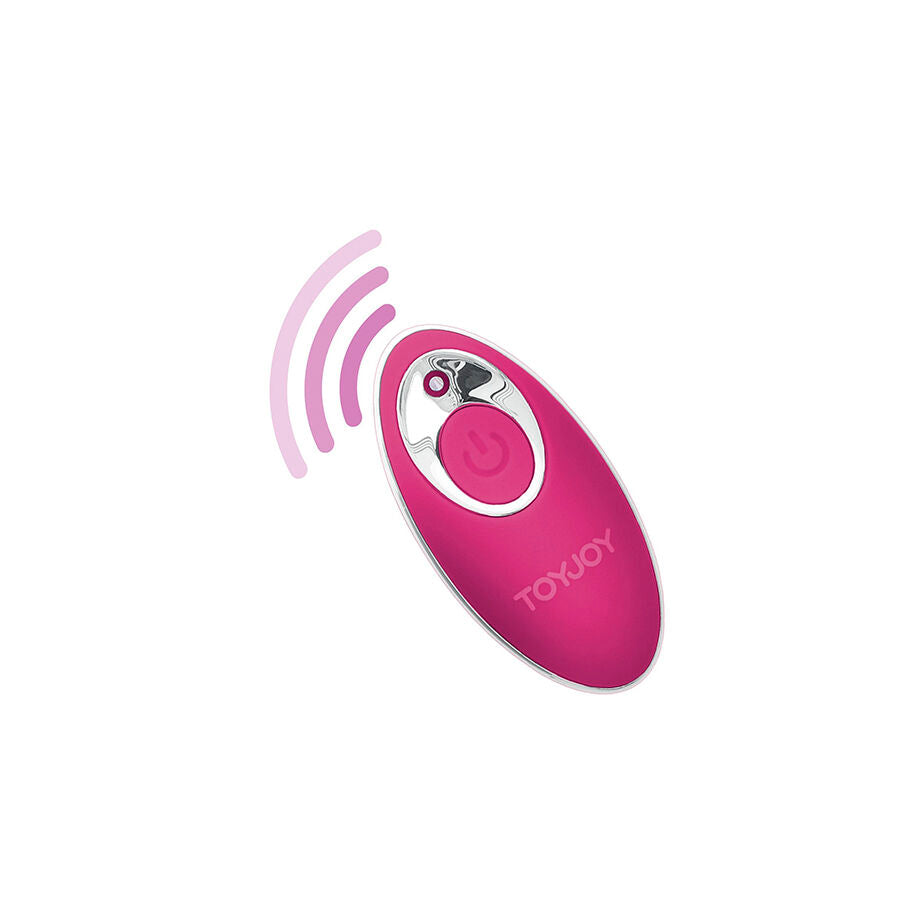 Telecommande sans fil rose fonce de l'oeuf vibrant Toy Joy, bouton central et ondes stylisees. Boitier pilotant a distance les 8 modes de stimulation.