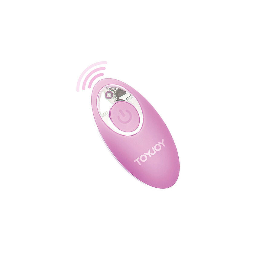Telecommande sans fil rose de l'oeuf vibrant Toy Joy, bouton central et ondes stylisees. Boitier ergonomique pilotant a distance les 8 modes de vibration.