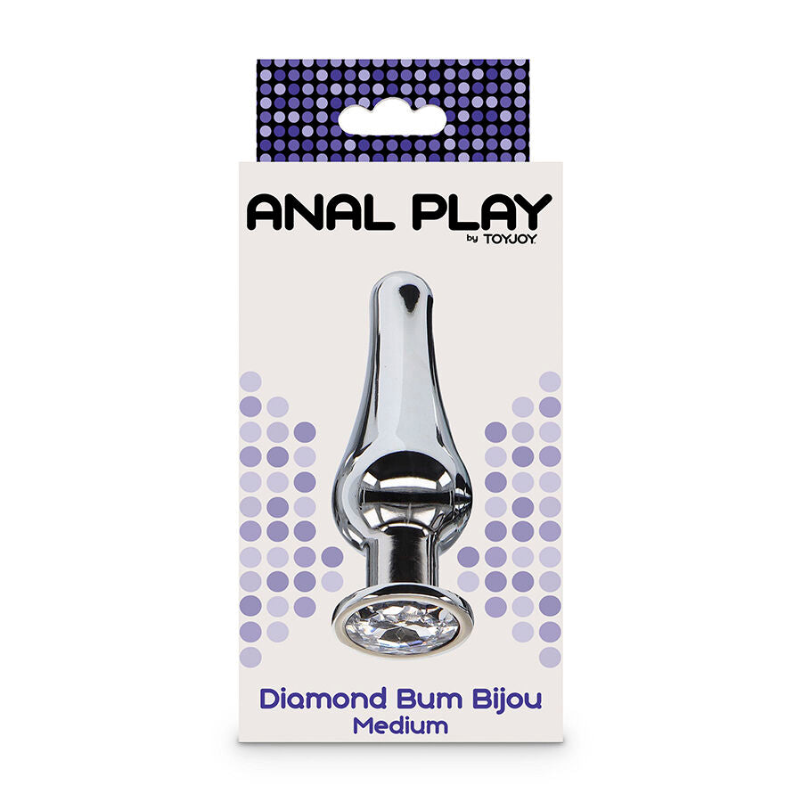 Boite Anal Play du plug bijou Diamond Bum Bijou Medium, packaging violet a pois presentant le plug chrome a strass, ligne d'initiation anale facon diamant.