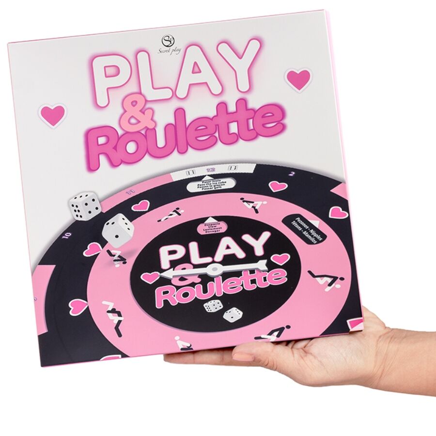 Boite et plateau Play & Roulette Secretplay tenus en mains, roulette rose et noire a cœurs avec des, jeu de roulette coquin progressif pour couple.