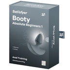 Boite Satisfyer Booty Absolute Beginners 1 grise, packaging Vibrating Anal Plug avec visuel du plug silicone, mentions Anal Training et Unisex.