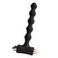 Plug anal perlé noir à chapelet de billes étagées sur base vibrante en T à embout métallisé, présenté seul sur fond clair, silicone lisse non figuratif.