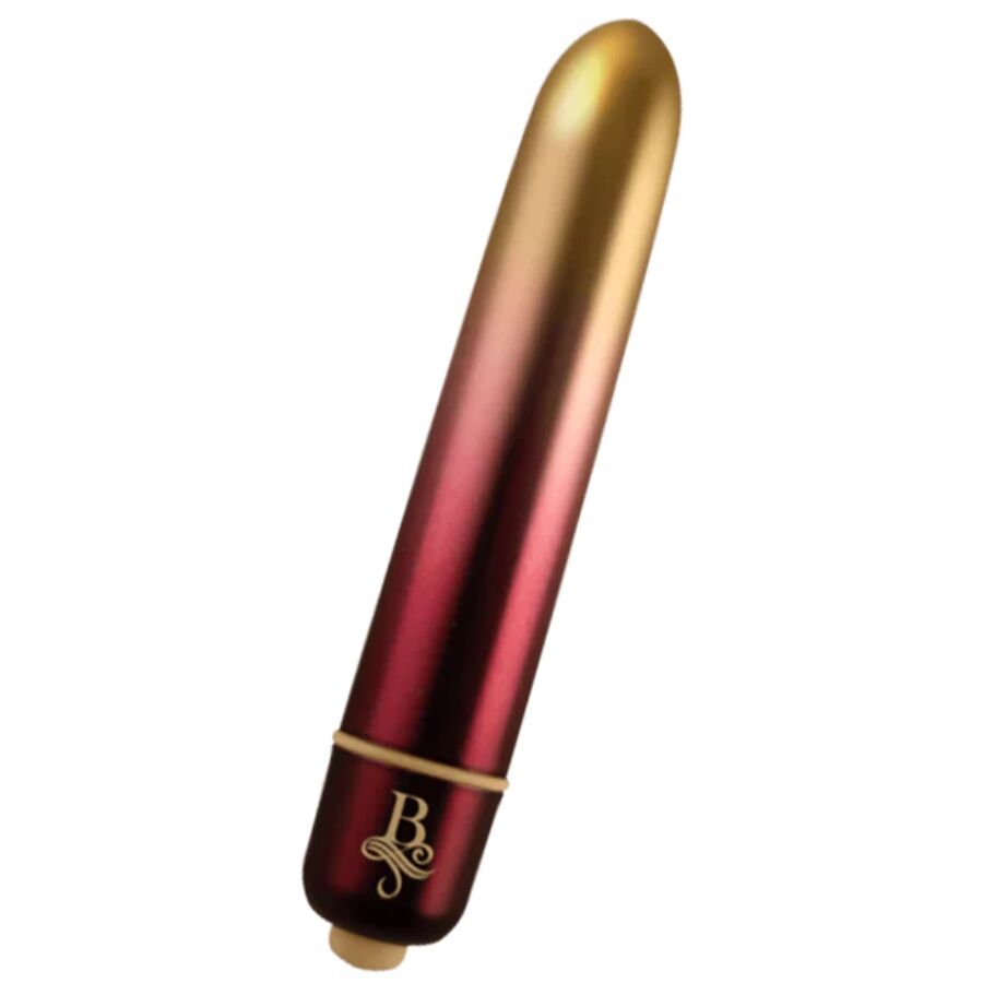 Bullet vibrant dégradé or-rouge présenté incliné, pointe arrondie et embout doré de commande, mini vibromasseur clitoridien compact à finition métallisée bicolore.