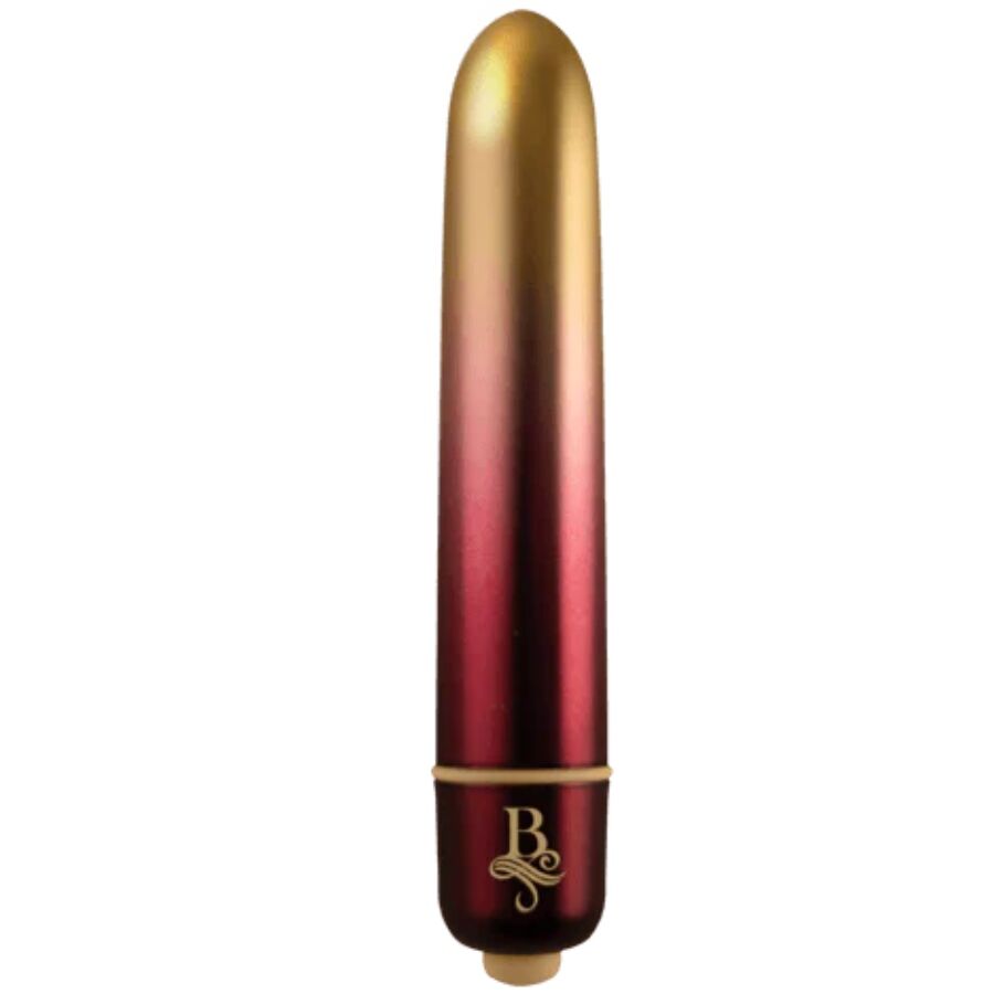 Bullet vibrant dégradé or-rouge dressé sur sa base, pointe arrondie et logo Rocks-Off, mini vibromasseur clitoridien compact à finition métallisée bicolore.