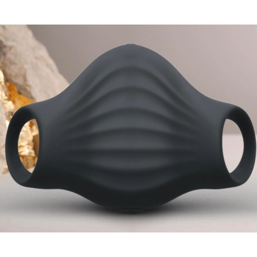 Masturbateur Palm noir dressé devant une pierre claire, gaine en silicone nervuré aux boucles ouvertes, accessoire vibrant flexible 10 modes étanche Rocks-Off.