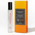 Parfum aux phéromones homme notes boisées Earth's Desire, roll-on transparent devant sa boite orange Pheromone Cologne, eau de parfum cypres bergamote tabac patchouli vegan.