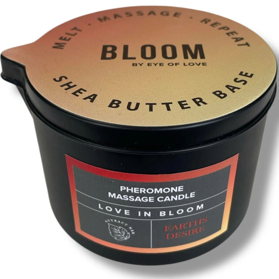 Bougie de massage Earth's Desire vue de dessus, pot noir Pheromone Massage Candle au couvercle dore Shea Butter Base, cire boisee qui se transforme en huile de massage.