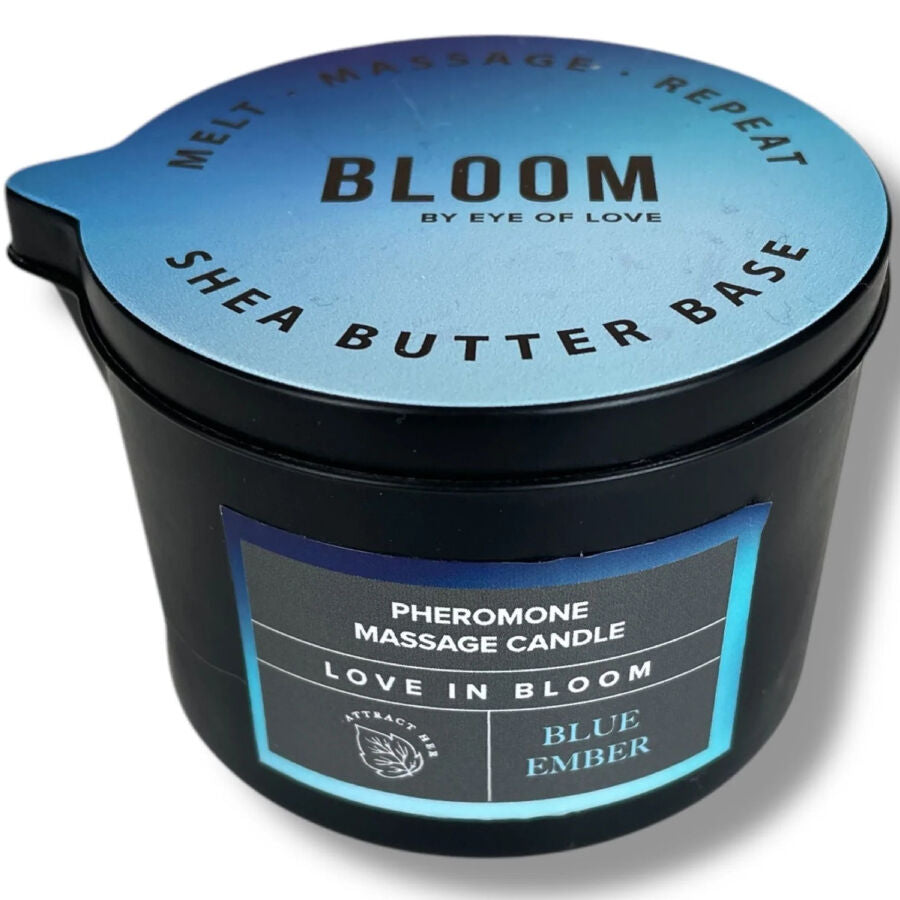 Bougie de massage Blue Ember vue de dessus, pot noir Pheromone Massage Candle au couvercle bleu Shea Butter Base, cire fraiche qui fond en huile de massage tiede Eye Of Love.