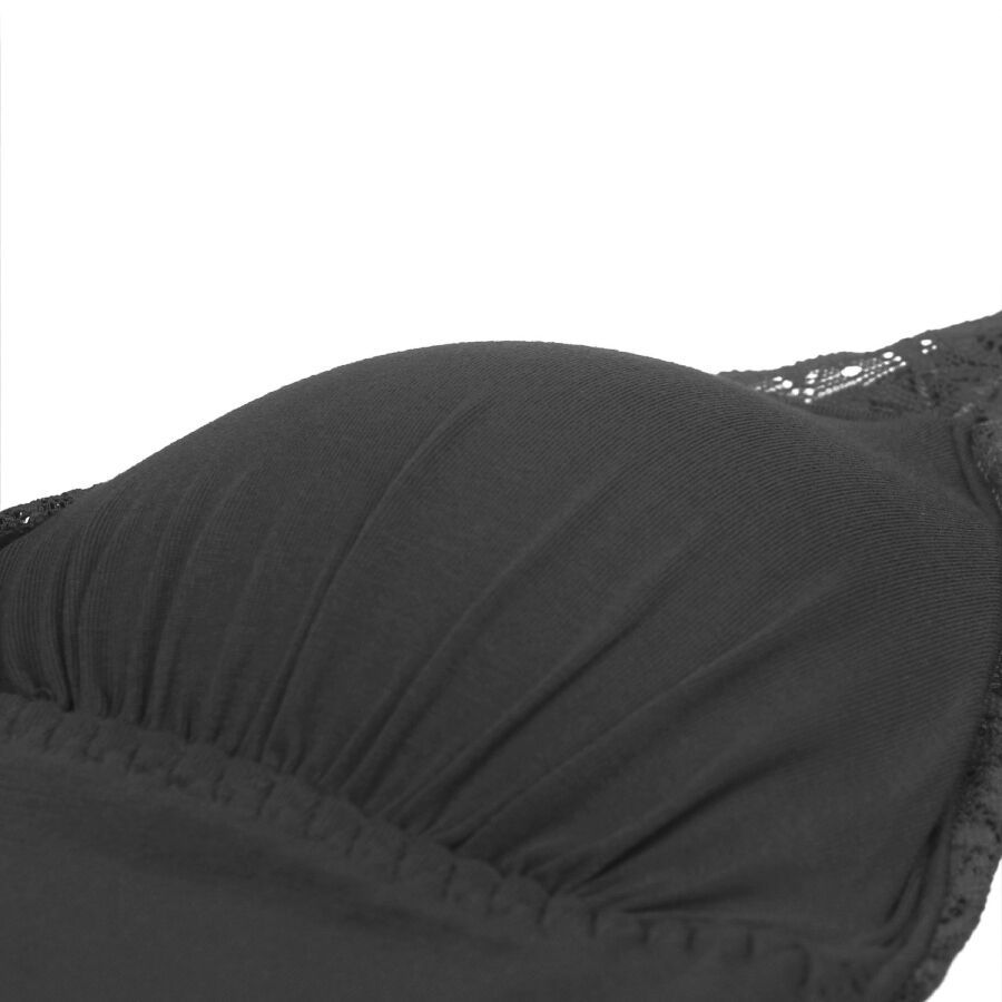 Detail du bonnet et de la bande de taille du teddy noir Subblime, jersey souple plisse et liseret dentelle, illustration de la texture matelassee douce.