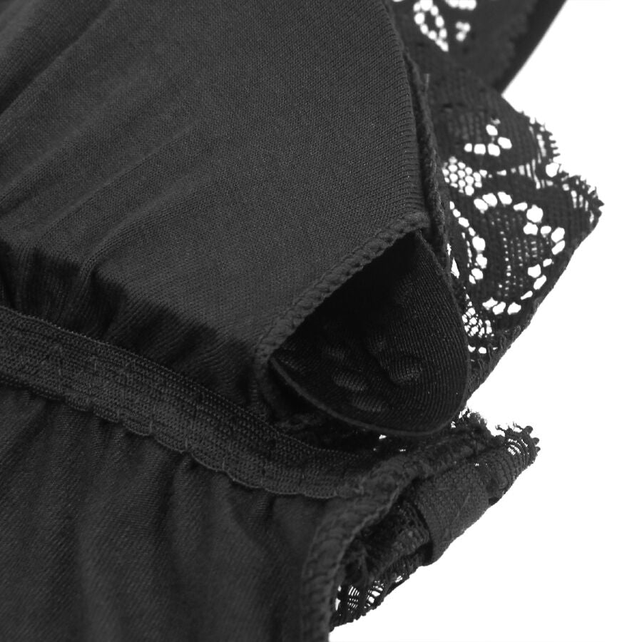 Detail de la couture laterale du teddy noir Subblime, raccord entre jersey doux et dentelle florale a la hanche, vue rapprochee de la fabrication.