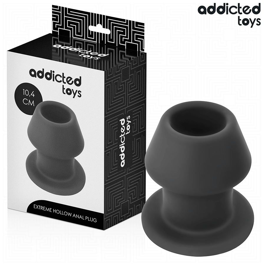 Boite Addicted Extreme Hollow Anal Plug 10,4 cm avec le plug creux en silicone noir a cote, forme champignon ouverte et large base evasee de maintien.