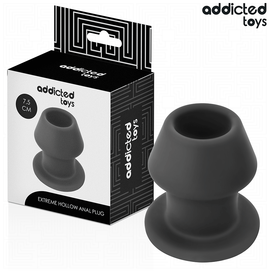 Boite Addicted Extreme Hollow Anal Plug 7,5 cm presentee avec le plug creux en silicone gris a cote, tunnel central et large base evasee de maintien.