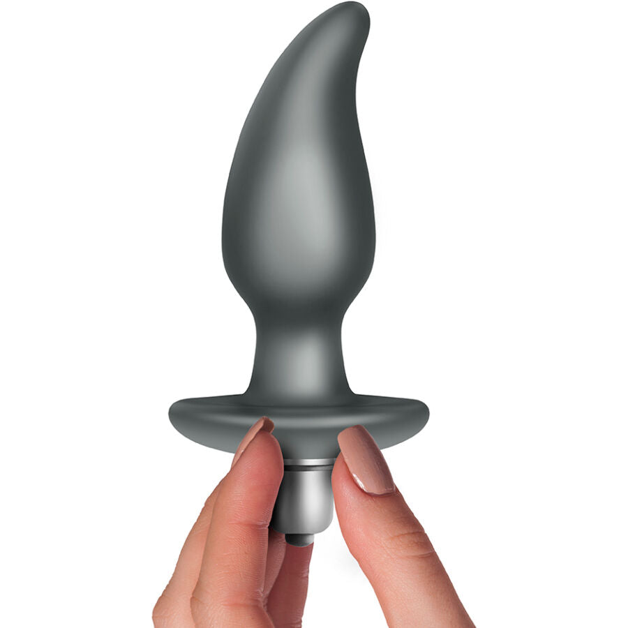 Plug anal vibrant Idosi tenu entre les doigts, gros plan sur l'embout incurve, l'ogive vibrante amovible doree et la base evasee, silicone doux etanche.