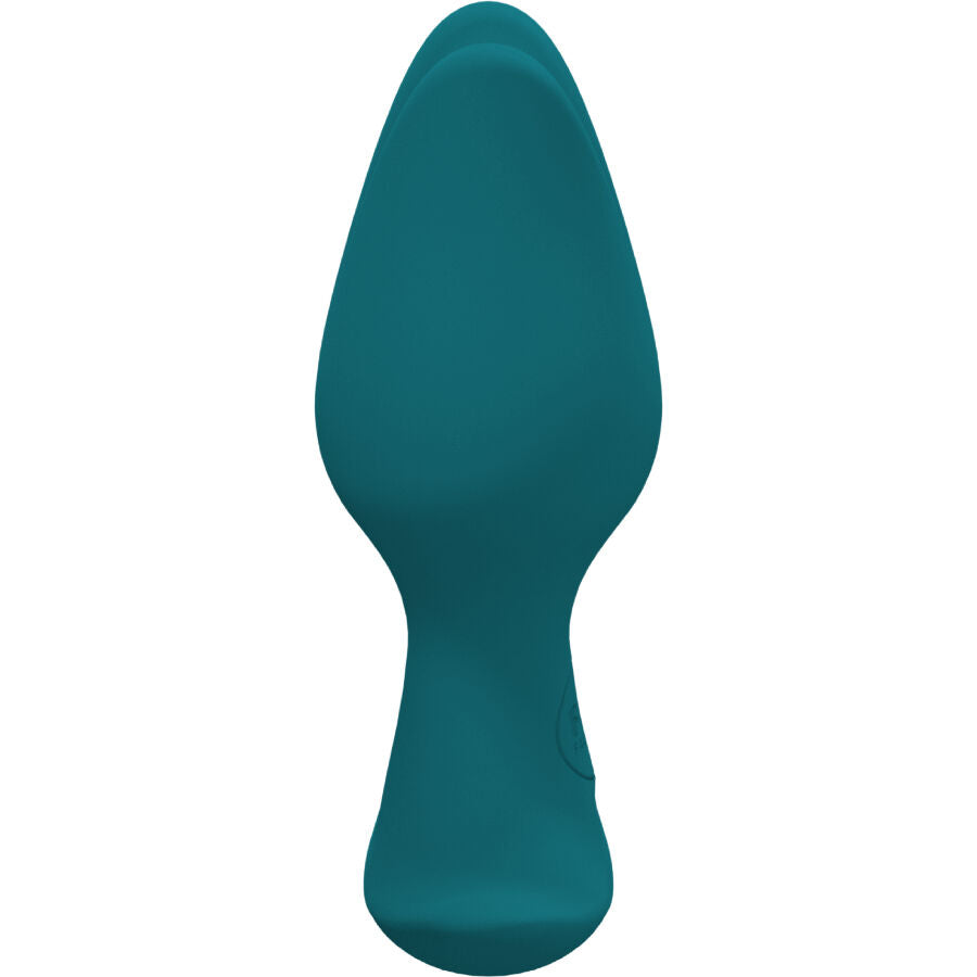 Plug anal vert sapin en vue rapprochee, corps conique lisse et col fin marque, profil arrondi facile a inserer, environ 8,5 cm en silicone.