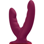 Double gode vibrant Ryde en silicone prune vu de trois quarts, deux tiges courbes a surface striee et large ventouse, combinant stimulation clitoridienne, vaginale et anale mains libres.
