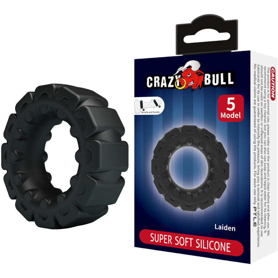 Anneau penien Crazy Bull Laiden en silicone pres de sa boite Super Soft Silicone 5 Model, bague noire au design pneu cranté a gros pavés stimulants.