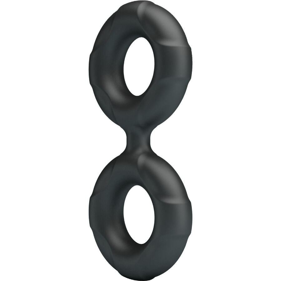 Anneau penien double silicone noir en vue de trois quarts, boucles galbees au fini mat, structure flexible adaptable a la morphologie pour prolonger les sensations.