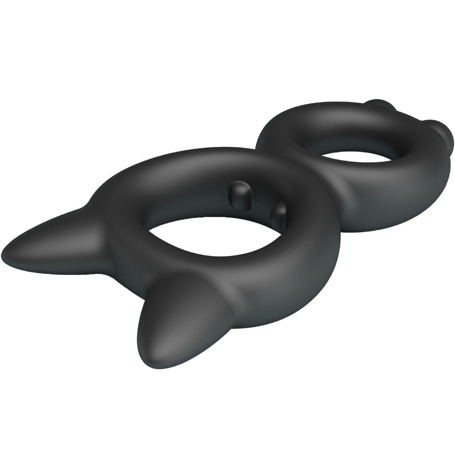 Anneau penien double en silicone noir vu en angle dynamique, boucles asymetriques aux pointes saillantes, matiere ultra-souple conçue pour le plaisir partage.
