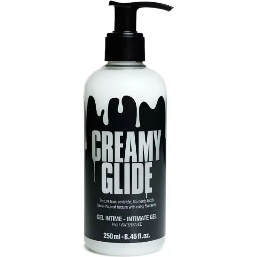 Flacon pompe Creamy Glide gel intime a base d'eau 250 ml, vue de face, etiquette noire au motif coulant, texture nuru filante a filaments laiteux soyeux