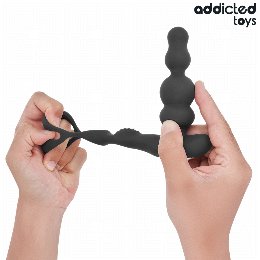 Masseur de prostate Addicted a perles et anneau tenu entre les mains pour montrer sa souplesse, silicone noir flexible, stimulateur prostatique telecommande.
