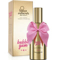 Coffret et flacon dores du gel 2 en 1 Bubble Gum Bijoux Indiscrets, gros noeud satin rose, mention massage et lubrifiant, packaging gourmand sur fond blanc
