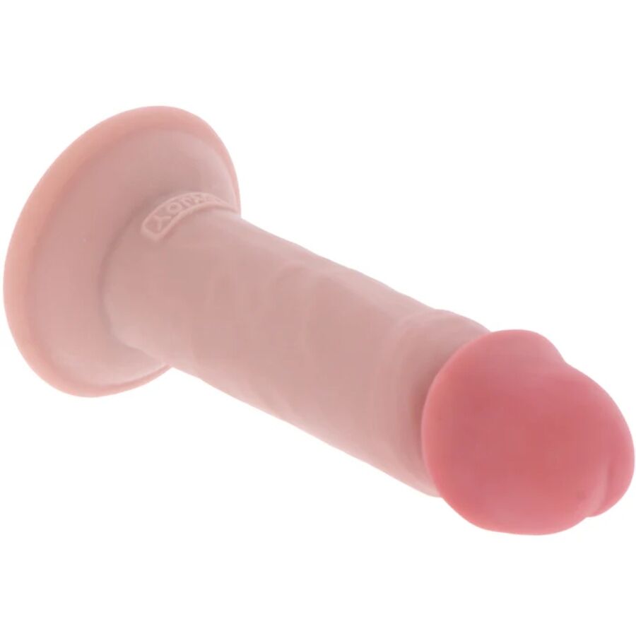 Gode realiste Get Real chair pose a plat, ventouse et gland marque bien visibles, tige courte en silicone double densite pour un usage mains libres en douceur.