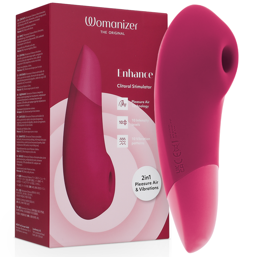Boîte Womanizer 'Enhance' rose à gauche et stimulateur clitoridien framboise à droite : embout d'aspiration rond et corps galbé bicolore en silicone, sans anatomie.