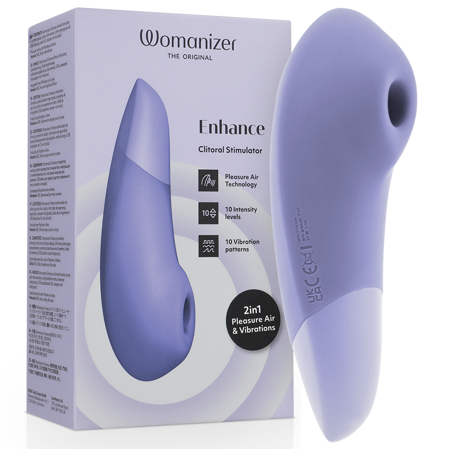 Boîte Womanizer 'Enhance' lilas à gauche et stimulateur clitoridien lilas à droite : embout de succion rond et corps galbé bicolore en silicone lisse, sans anatomie.