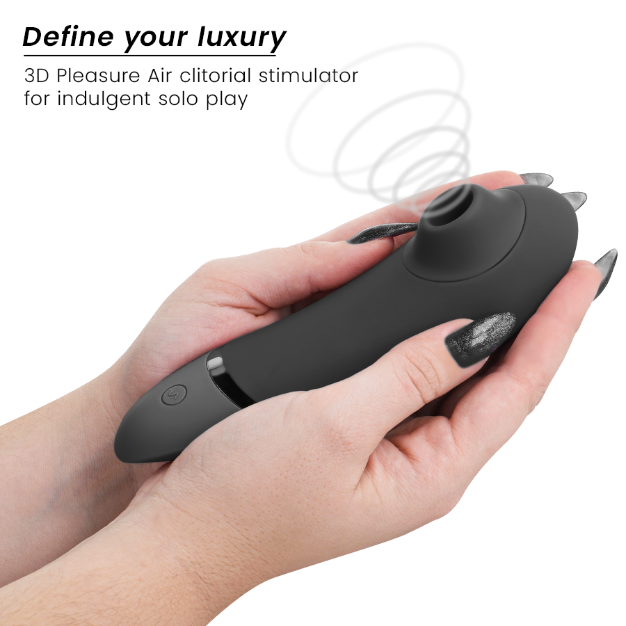 Main tenant le Womanizer Next noir avec schéma d'ondes d'air illustrant l'aspiration 3D Pleasure Air sans contact, texte Define your luxury en surimpression.