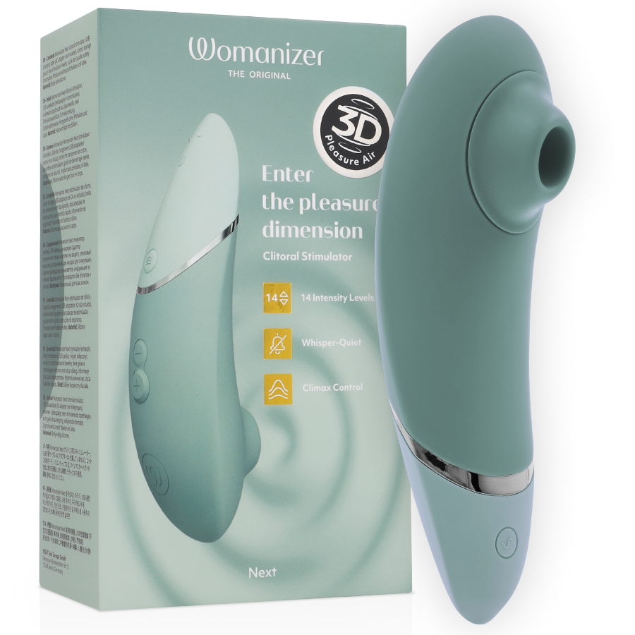Boîte verte du Womanizer Next avec le stimulateur vert sauge intégré au visuel de face, badge 3D et mention Enter the pleasure dimension, packaging sans anatomie.