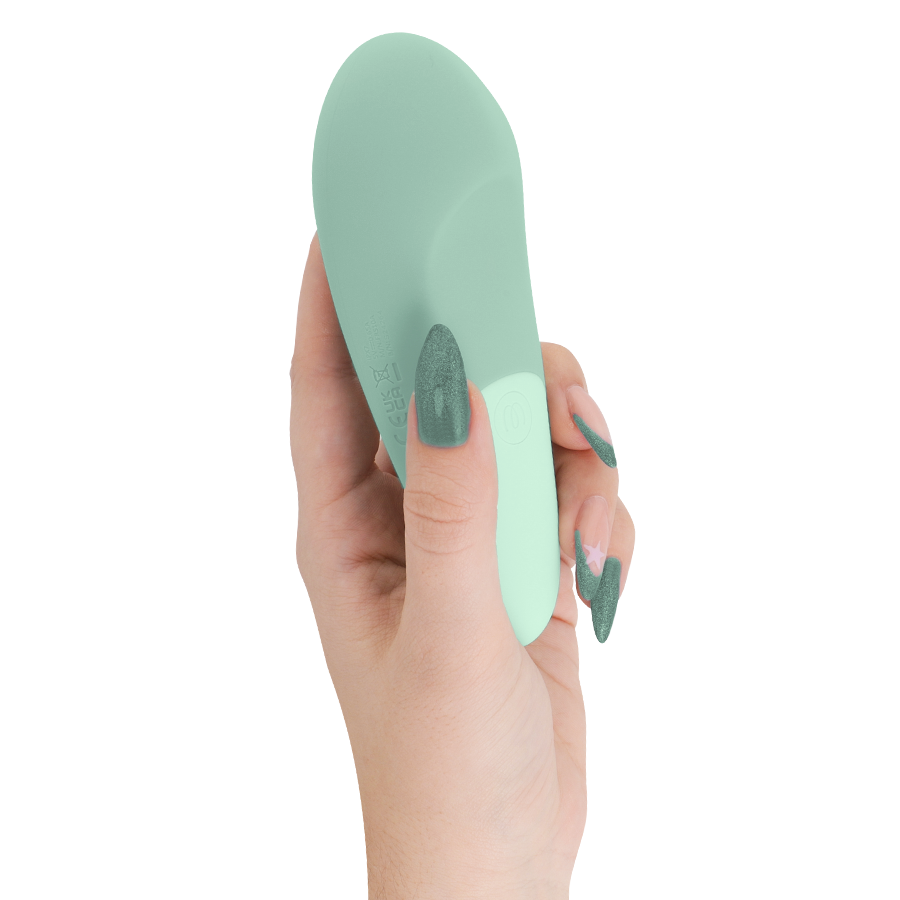 Vibromasseur clitoridien à poser UltraWave Vibe vert sauge tenu verticalement en main, surface en silicone lisse bicolore, vibrations profondes du moteur linéaire.