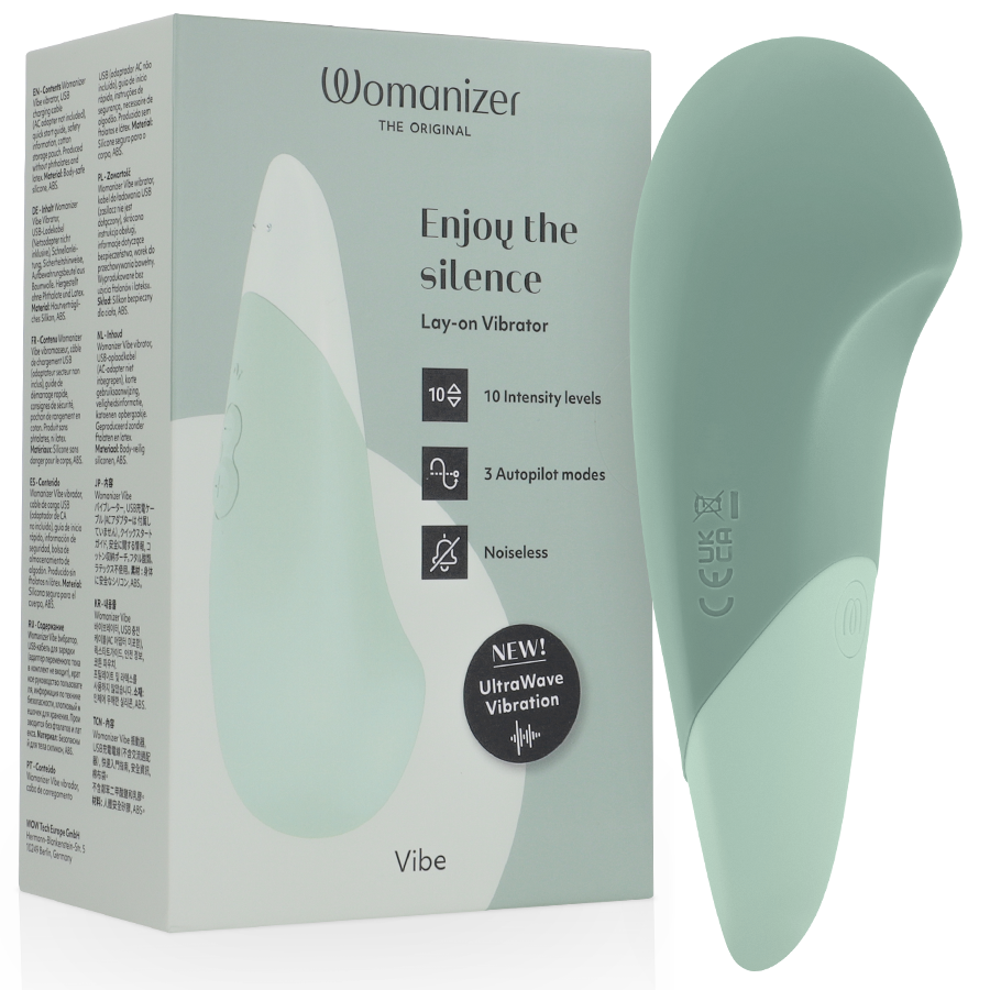 Boîte verte du vibromasseur à poser UltraWave Vibe à côté du stimulateur vert sauge galbé bicolore, mention Enjoy the silence, technologie UltraWave silencieuse.