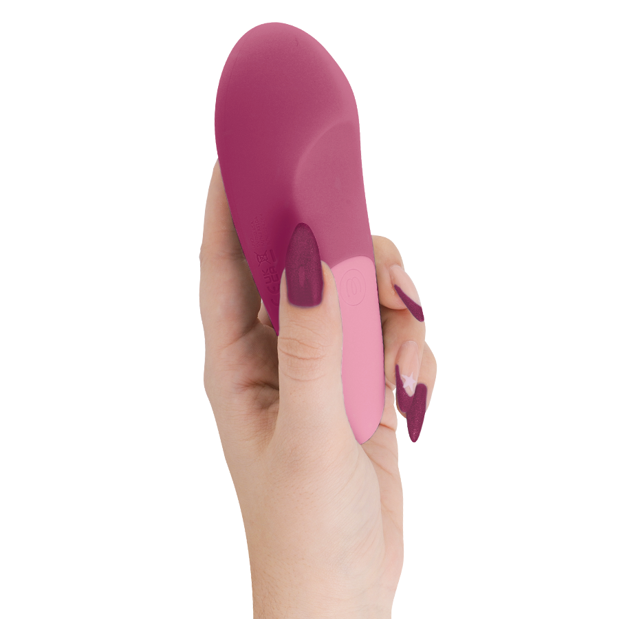 Vibromasseur clitoridien à poser UltraWave Vibe rose framboise tenu verticalement en main, surface en silicone lisse bicolore, vibrations profondes et basses.