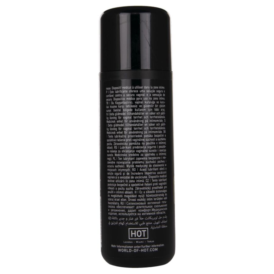 Dos du flacon Premium Glide lubrifiant silicone 100 ml, notice multilingue dense sur fond noir, lubrifiant soyeux qui ne seche pas.